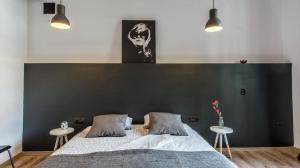 Posteľ alebo postele v izbe v ubytovaní Sereno Apartments