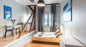 Posteľ alebo postele v izbe v ubytovaní Fenna Apartments 7 minut od Rynku
