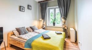Posteľ alebo postele v izbe v ubytovaní Fenna Apartments 7 minut od Rynku