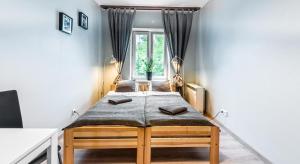 Posteľ alebo postele v izbe v ubytovaní Fenna Apartments 7 minut od Rynku