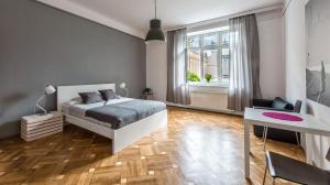 Posteľ alebo postele v izbe v ubytovaní Fenna Apartments 7 minut od Rynku