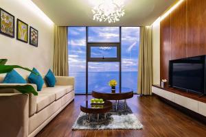 A television and/or entertainment centre at Maximilan Danang Beach Hotel