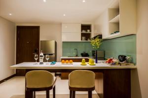 A kitchen or kitchenette at Maximilan Danang Beach Hotel