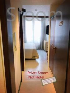 a room with a bed and a door with a not hotel at Sroom 118 and 119 in Center in Reutlingen