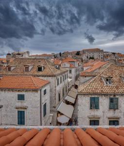 a view of a city from the roofs of buildings at Palmotta Palace in Dubrovnik