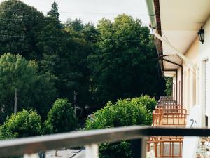 a view from a balcony of a house with trees at Pedras Salgadas Apartment in Pedras Salgadas