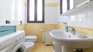 a bathroom with a sink and a toilet at Italianway - Ottoventi Apartments in Lampedusa