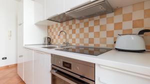 a kitchen with a sink and a toaster at Italianway - Ottoventi Apartments in Lampedusa
