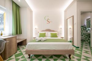 Postel nebo postele na pokoji v ubytování Gea Suite B&B