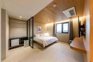 Postel nebo postele na pokoji v ubytování Brown-Dot Hotel Ulsan-Sincheon