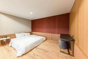 Postel nebo postele na pokoji v ubytování Brown-Dot Hotel Ulsan-Sincheon