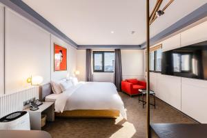 Postel nebo postele na pokoji v ubytování Brown-Dot Hotel Ulsan-Sincheon