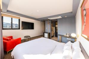 Postel nebo postele na pokoji v ubytování Brown-Dot Hotel Ulsan-Sincheon