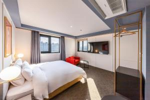 Postel nebo postele na pokoji v ubytování Brown-Dot Hotel Ulsan-Sincheon