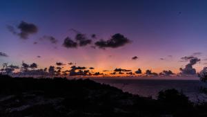 a sunset over a body of water at Italianway - Ottoventi Apartments in Lampedusa