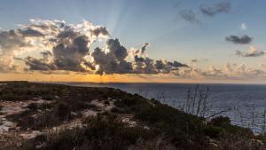 a view of the ocean under a cloudy sky at Italianway - Ottoventi Apartments in Lampedusa