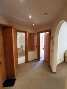 a hallway with two doors and a bathroom at Haus Edelweiss in Oberstdorf