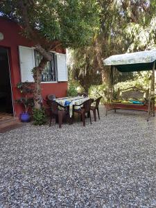 a patio with a table and chairs in front of a house at Location Vacances Casablanca Tamaris in Casablanca