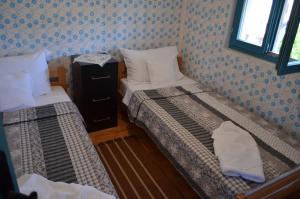 Voodi või voodid majutusasutuse Srpsko Andrejevo Selo toas