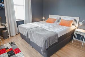 Postel nebo postele na pokoji v ubytování Hotel Stensson