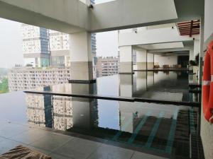 a pool on the roof of a building at Delight Homestay Twin Galaxy in Johor Bahru