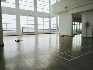 an empty room with wood floors and large windows at Delight Homestay Twin Galaxy in Johor Bahru