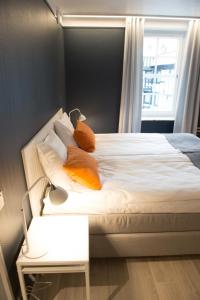 Postel nebo postele na pokoji v ubytování Hotel Stensson
