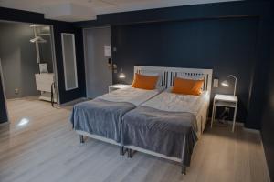 Säng eller sängar i ett rum på Hotel Stensson