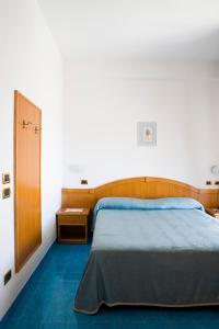 Postel nebo postele na pokoji v ubytování Hotel La Primavera