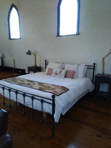 سرير أو أسرّة في غرفة في 1888 Oxley B&B