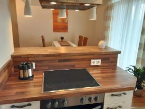 a kitchen with a counter with a stove top oven at Wanderglück Rotenfels in Traisen