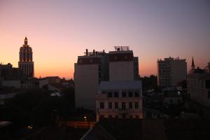 a view of a city skyline at sunset at MELINI Boutique Hotel in Batumi