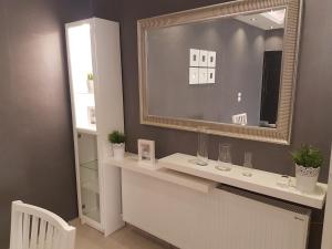 a bathroom with a sink and a mirror at Second Home in Amman