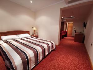 Mali Hotel BaMBiS客房内的一张或多张床位
