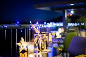 a bottle of champagne sitting on a table with stars at Boutique & Design Hotel Navis - Small Luxury Hotels of the World in Opatija