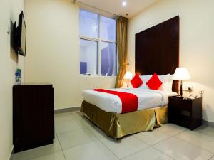 Postel nebo postele na pokoji v ubytování SH Hotel