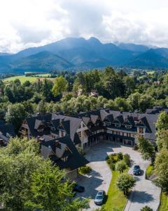 an aerial view of a resort with mountains in the background at Aparthotel Bellamonte in Zakopane