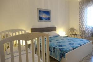 Postel nebo postele na pokoji v ubytování Don Alfonso Apartaments