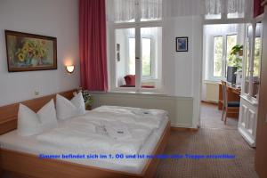 Postel nebo postele na pokoji v ubytování Hotel Nordlicht