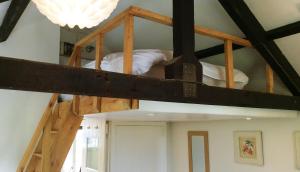 a room with two bunk beds in a room at The Granary in Braunton