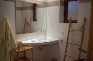 a bathroom with a sink and a mirror at le gîte du Wildbach in Wildersbach