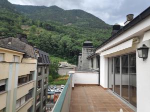 a balcony of a building with a view of a mountain at SUITEDREAMS - Pollancre 61 in Andorra la Vella