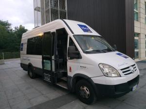 a small white truck parked in front of a building at Idea Hotel Milano Malpensa Airport in Case Nuove