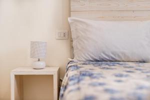 Postel nebo postele na pokoji v ubytování Lia Apartment