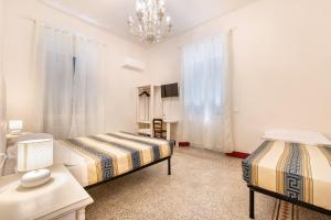 Postel nebo postele na pokoji v ubytování Lia Apartment