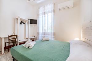 Postel nebo postele na pokoji v ubytování Lia Apartment