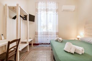 Postel nebo postele na pokoji v ubytování Lia Apartment