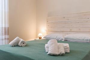 Postel nebo postele na pokoji v ubytování Lia Apartment