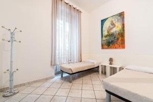 Postel nebo postele na pokoji v ubytování Lia Apartment