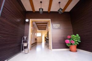 a hallway in a building with a clock on the wall at Austria Luxury Apartments, Faraya in Fārayyā